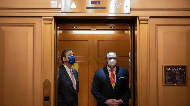 Bruce Castor (left), defence lawyer for former US president Donald Trump, in an elevator in the US Capitol on Tuesday. Photograph:  Chip Somodevilla/POOL/AFP via Getty Images