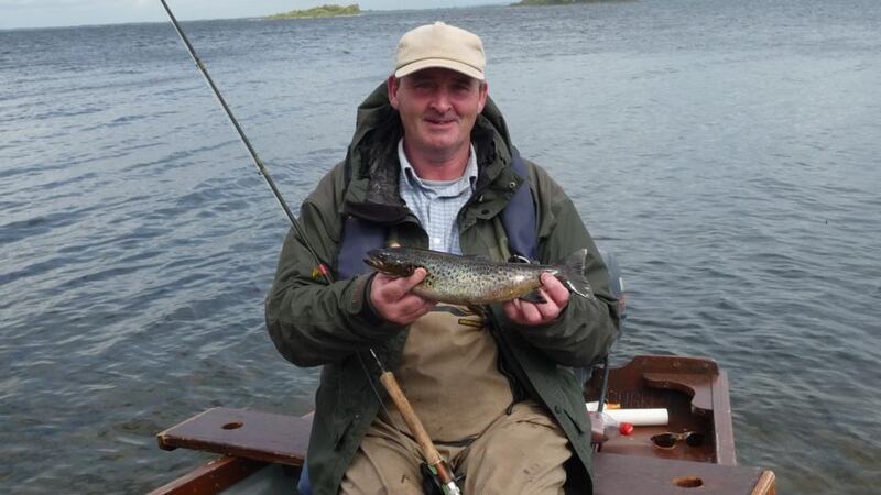 Mike Coyne with a good-sized trout during the VFI Fly Fishing Championships on Lough Mask