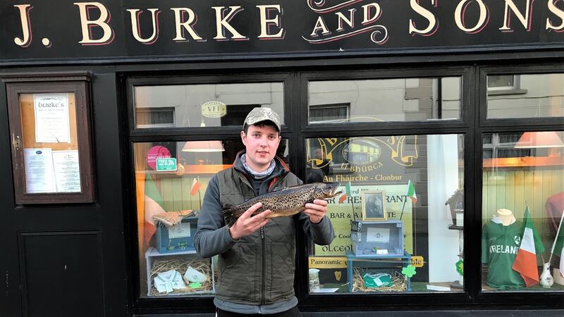 Mark Gibbons with the heaviest trout caught in the canal area on Lough Mask during the Burke fly fishing competition.