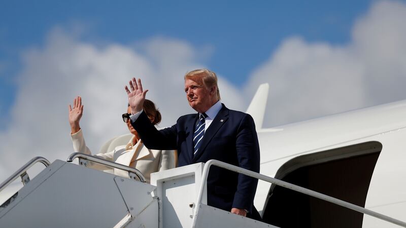 US president Donald Trump and first lady Melania Trump wave as they arrive at Shannon Airport in Co Clare on Wednesday. Photograph: Carlos Barria/Reuters.