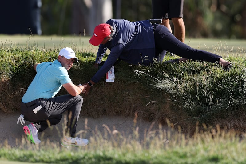 Rory McIlroy gets relief from an imbedded ball on the 14th hole during the final round of the 123rd US Open Championship at The Los Angeles Country Club last year. Photograph: Richard Heathcote/Getty Images