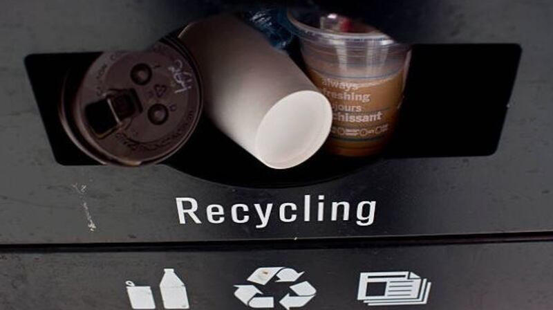 Contaminated recycling bin (above): Vincent Jennings, chief executive of the Convenience Stores and Newsagents Association,  told the Oireachtas Committee on Environment that the litter problem was compounded by a lack of facilities for recycling, problems with contaminated waste that cannot be re-used, and weaknesses in enforcement of existing laws. File photograph: Getty Images