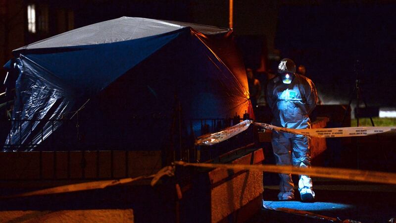 Garda forensic offciers at the scene of the murder of Christopher (aka Noel) Kirwan in Ronanstown, Dublin in 2016. Photograph: Caroline Quinn/PA Wire