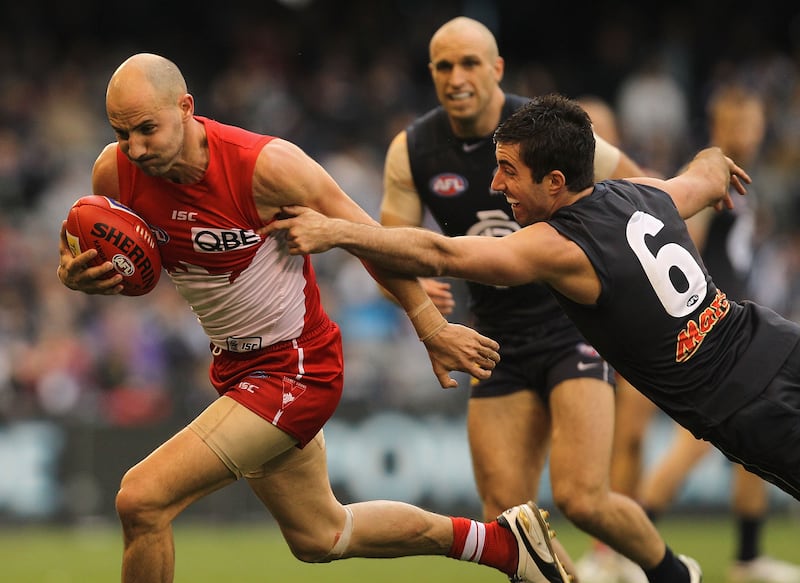 Tadhg Kennelly (left) playing for the Sydney Swans in June 2011. Photograph: Hamish Blair/Getty Images