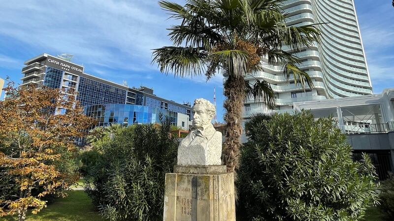 A 1937 bust of the poet Alexander Pushkin in a park in Sochi, southern Russia, overshadowed by one of the city’s many new hotels. Photograph: Daniel McLaughlin