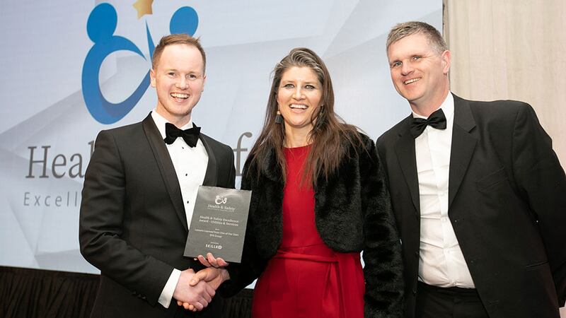 Brendan Maloney, chief executive at Skillko, presents the Health & Safety Excellence Award - Utilities & Services to John Lynch and Rose Healy, EPS Group