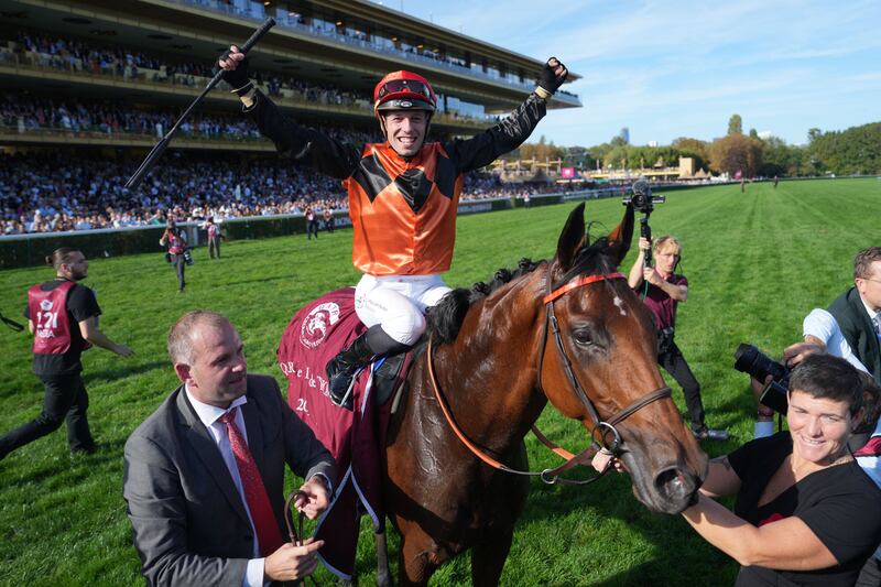 Italian jockey Cristian Demuro  celebrates his victory on  Ace Impact in the Qatar Prix de l'Arc de Triomphe. Photograph: Dimitar Dilkoff/AFP via Getty Images