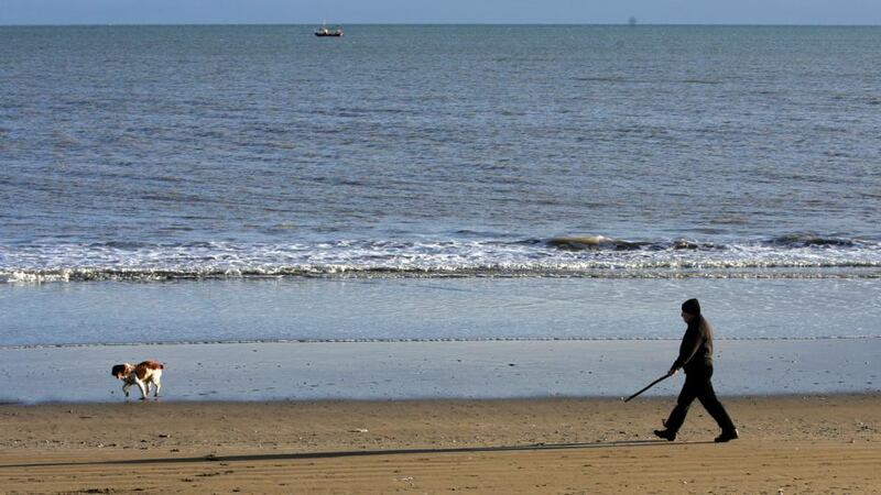 Walking the beach in winter sunlight at Clogherhead, Co. Louth. Photograph: Eric Luke