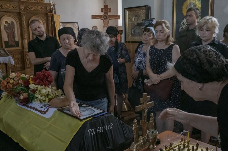 Mourners attend the funeral for the Ukrainian soldier Anatoly Mykolayovych Potaychuk in Babyntsi, Ukraine, on Saturday. Photograph: Mauricio Lima/New York Times