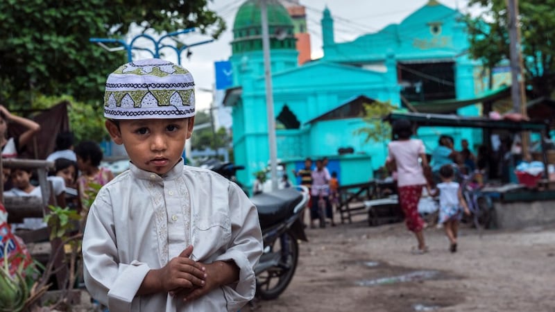 A young Muslim boy photographed outside the Mosque in the Muslim district of Mandalay, Myanmar's second largest city. Photograph: Brenda Fitzsimons