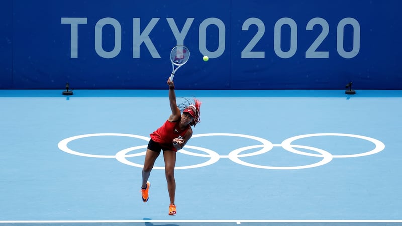 Naomi Osaka serves against Viktorija Golubic. Photo: Michael Reynolds/EPA