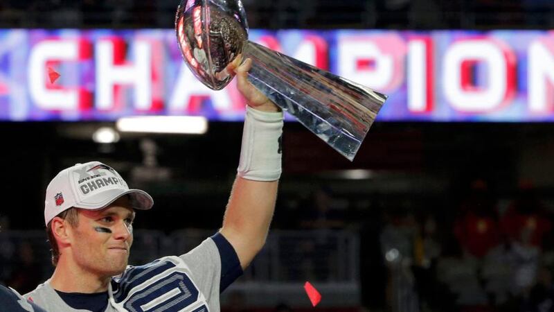 New England Patriots quarterback Tom Brady holds up the Vince Lombardi Trophy. Photograph: Brian Snyder/Reuters