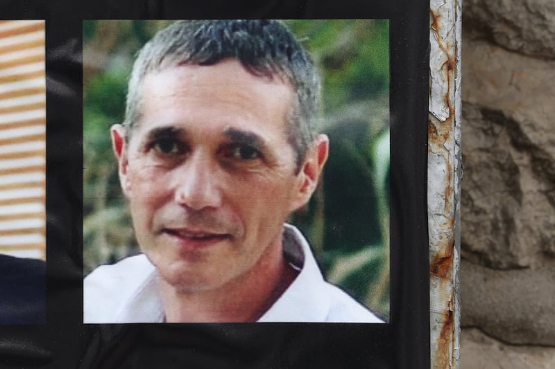 A portrait of rescued Israeli-Argentinian hostage Fernando Simon Marman hangs on a wall in central Jerusalem. Photograph: Ahmad Gharabli/AFP via Getty Images