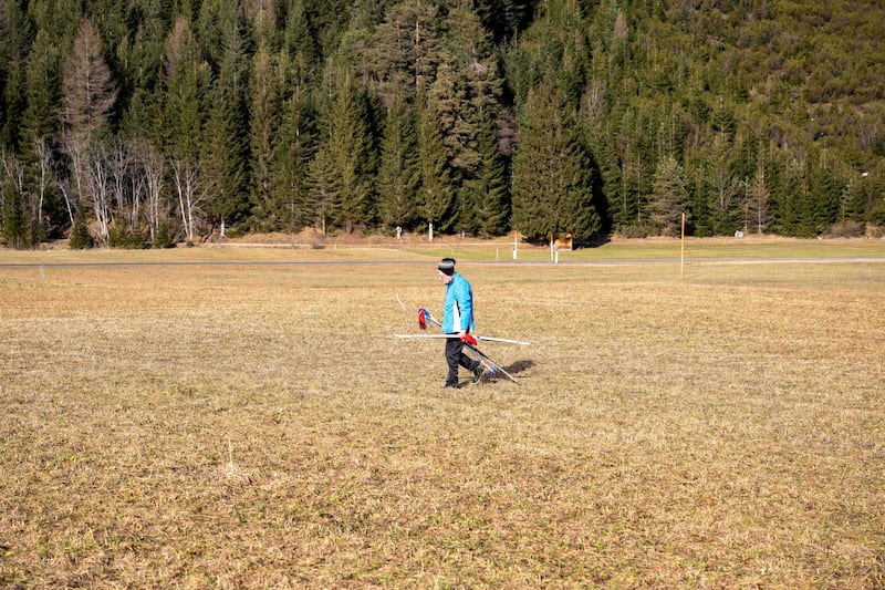 A ski tourist walks across a snow-free meadow in Leutasch, Austria on January 2nd. Photograph: Daniel Leible/zeitungsfoto.at/AFP via Getty