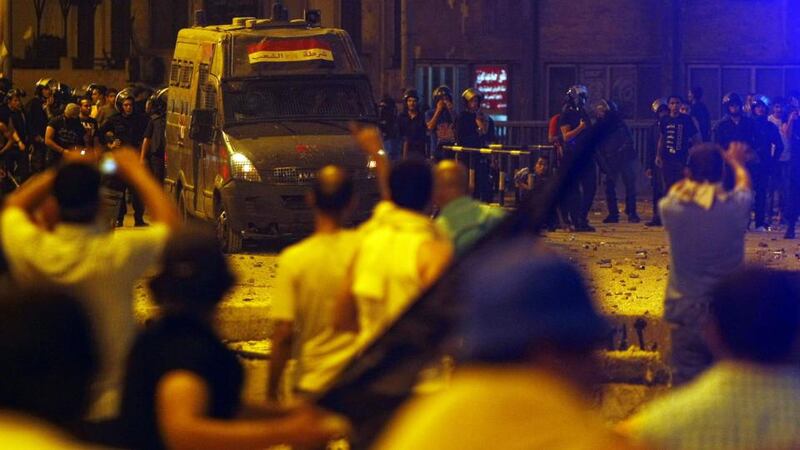 Supporters of deposed Egyptian president  Morsi clash with riot police on the Sixth of October Bridge over the Ramsis square area in central Cairo. Photograph: Amr Abdallah Dalsh/Reuters