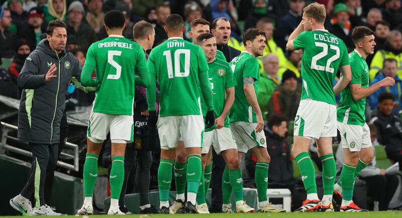 Ireland assistant coach Paddy McCarthy and interim head coach John O'Shea speak to the team. Photograph: James Crombie/Inpho