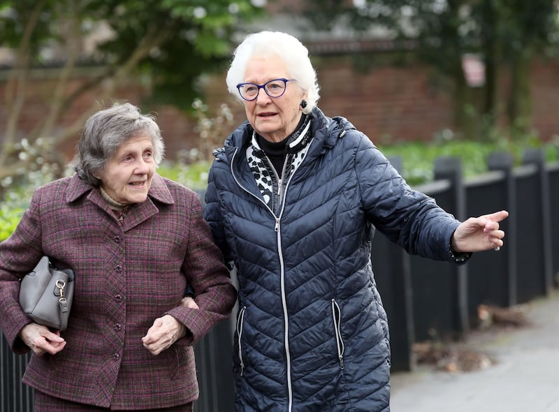 Former Olympic gold medallist Mary Peters (right) arrives at the funeral of poet Michael Longley. Photograph: Stephen Davison/The Irish Times