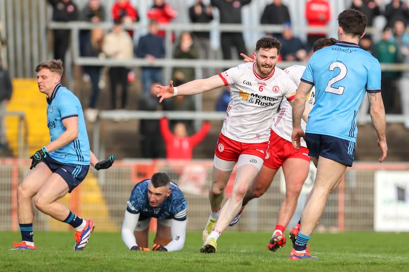 Tyrone's Rory Brennan celebrates Michael McKernan’s goal during the game against Dublin at O'Neill's Healy Park. Photograph: Lorcan Doherty/Inpho