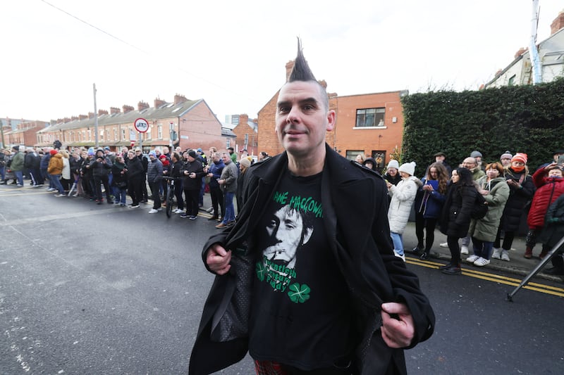 John Farrell from Tallaght watching the funeral procession  leaving Shelbourne Park on its way through Dublin. Photograph: Alan Betson

