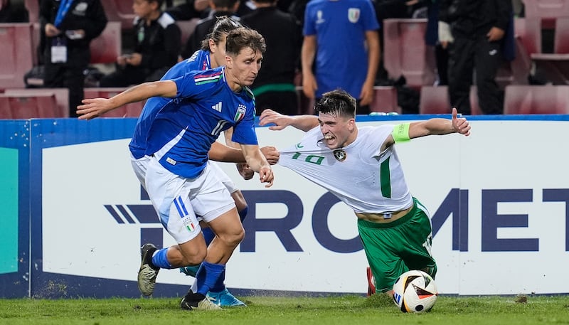 Ireland captain Andrew Moran is challenged by Italy's Tommaso Baldanzi and Daniele Ghilardi. Photograph: Matteo Ciambelli/Inpho