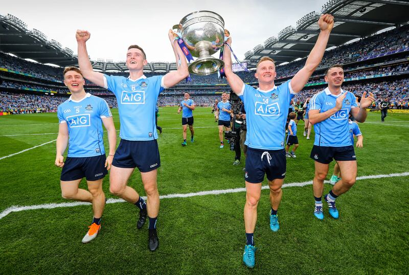 Dublin's Brian Fenton and Ciarán Kilkenny celebrate with The Sam Maguire trophy. Photograph: Ryan Byrne/Inpho