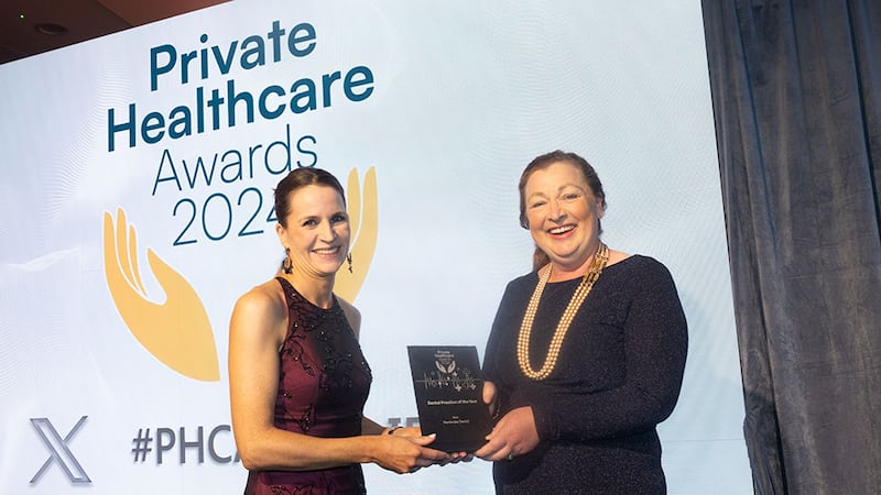 Brid Seoighe, awards judge, presents the dental practice of the year award to Brenda Barrett, Pembroke Dental.