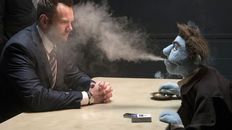 Leslie David Baker and Joel McHale in The Happytime Murders