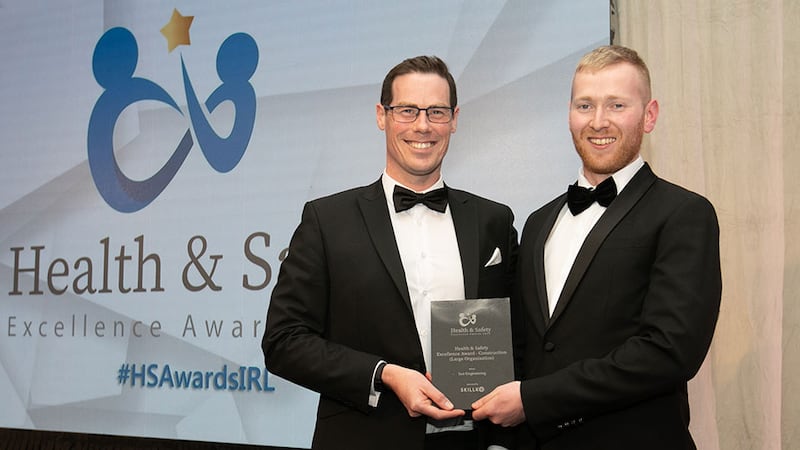 Dermot O'Connor, chief executive at Skillko, presents the Health & Safety Excellence Award - Construction (Large Organisation) to Neil Wall, BusinessRiver, on behalf of Suir Engineering