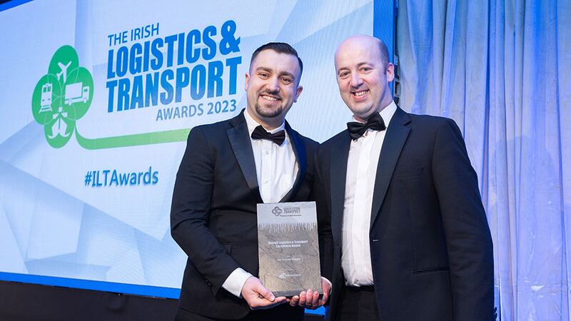 Adam Zurawski, Principal Recruitment Consultant, Driving Force, presents the Overall Logistics & Transport Excellence Award to Eamon Galavan, Ace Express Freight.