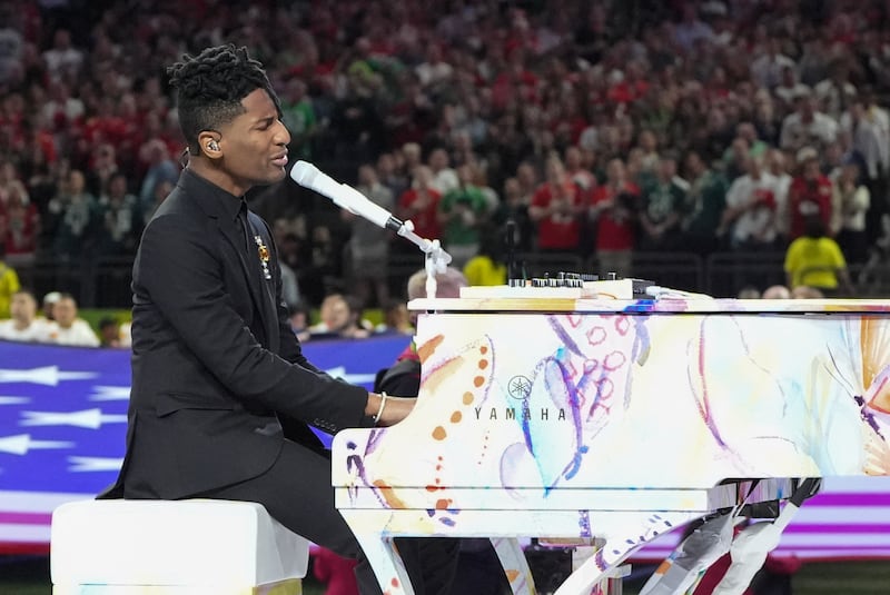 US singer-songwriter Jon Baptiste sings the National Anthem ahead of the game. Photograph: Timothy A. Clary/AFP