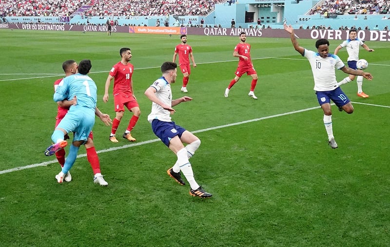 Iran's Alireza Beiranvand collides with team mate Majid Hosseini during the game against England. The incident led to a lengthy delay and Beiranvand leaving the pitch. Photograph: Hannah McKay - Pool/Getty Images