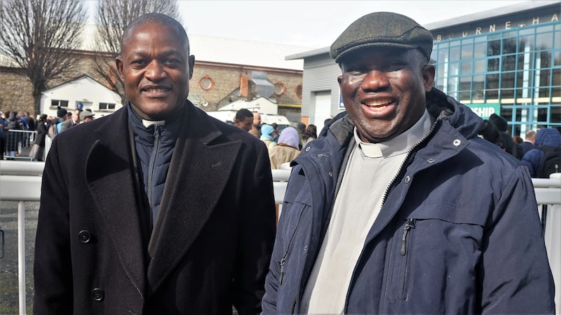 Catholic priests Fr John Kennedy Tibaagalika and Fr Lawrence Ebuk at the citizenship ceremony in the RDS on Friday. Photograph: Ronan McGreevy