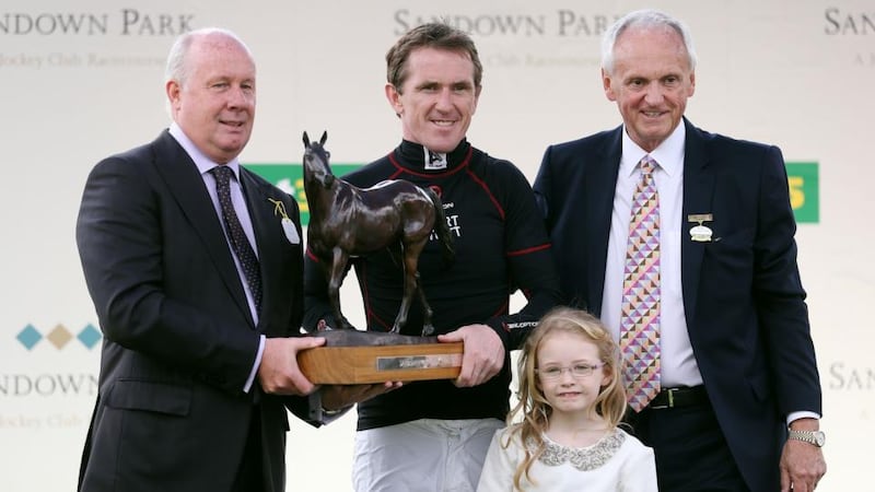 Tony McCoy receives a lifetime achievement award from former Republic of Ireland international  Liam Brady (left) on behalf of Sandown Racecourse during his final day riding as a professional. Photo:   David Davies/PA Wire