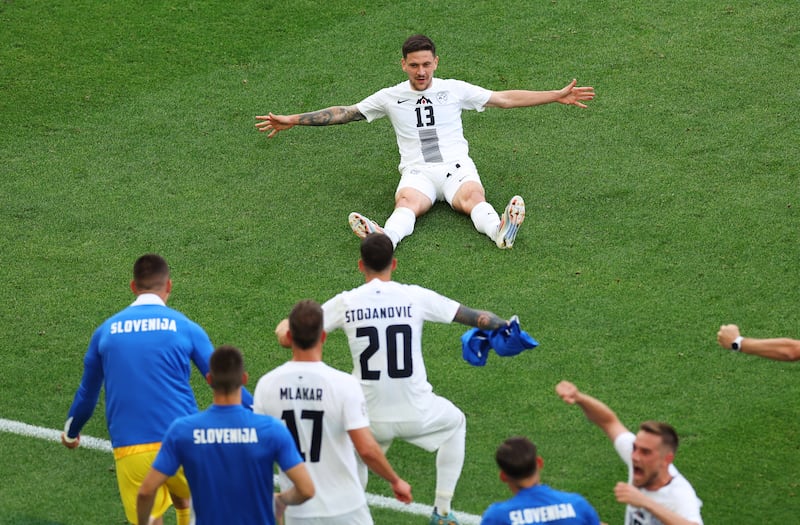 Erik Janza celebrates scoring Slovenia's equaliser during the Euro 2024 match against Denmark at Stuttgart Arena. Photograph: Carl Recine/Getty Images