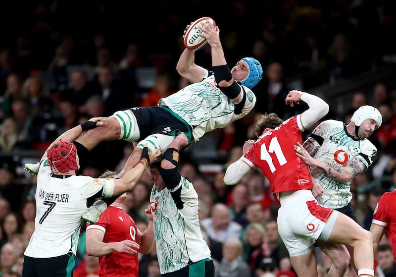 Tadhg Beirne of Ireland jumps for the ball with Ellis Mee of Wales. Photograph: Dan Istitene/Getty