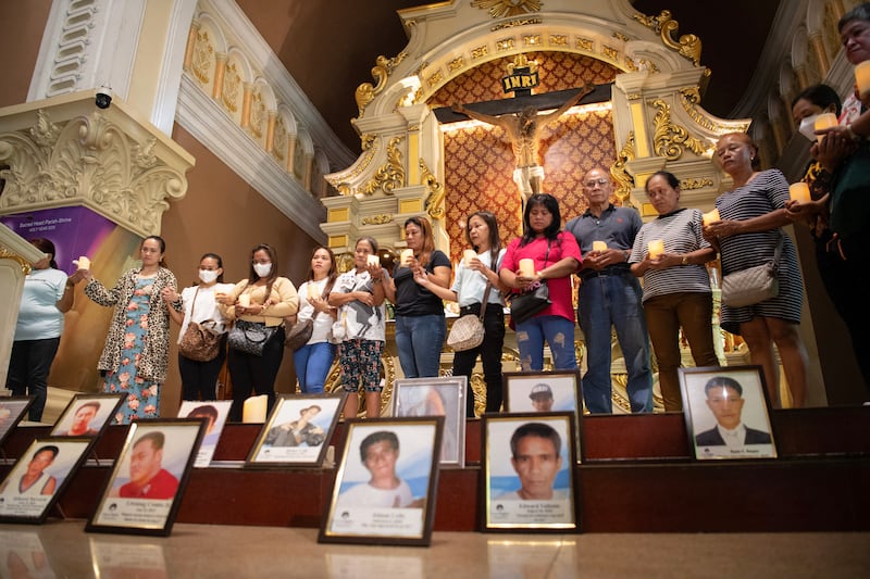 Relatives of victims of former Philippines president Rodrigo Duterte's war on drugs during a mass at a church in Manila on Tuesday. Photograph: Ted Aljibe/AFP via Getty Images