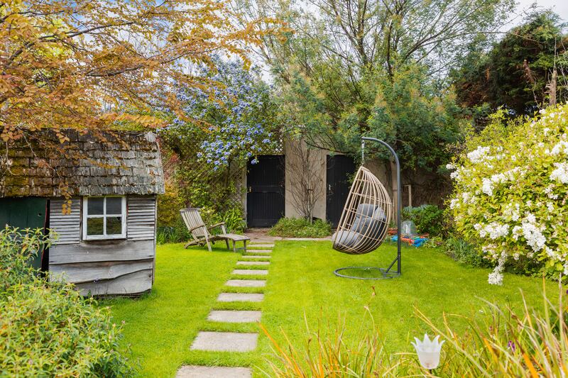 The rear garden is now mature and has a garage with off street car parking