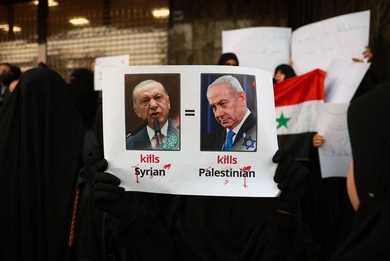 Protesters outside the Turkish embassy in Tehran, Iran denounced Turkish president Recep Tayyip Erdogan’s support of Syrian rebels and Israeli prime minister Binyamin Neanyahu's treatment of Gaza. Photograph: Abedin Taherkenareh/EPA