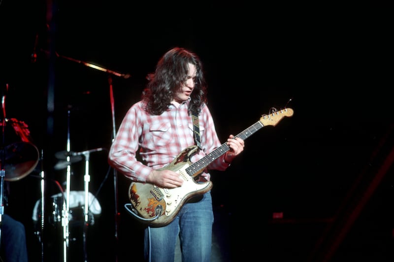 Rory Gallagher playing his 1961 Fender Stratocaster on stage. Photograph: Michael Ochs Archives/Getty Images