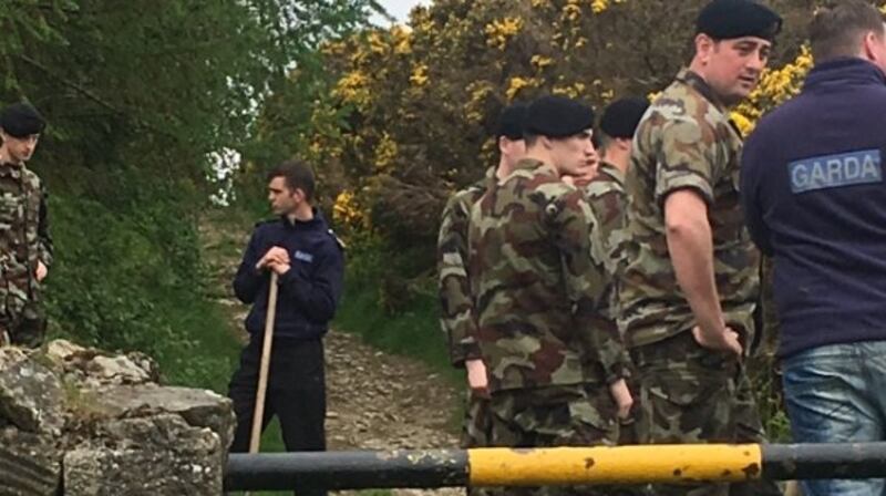 Gardaí and members of the Defence Forces prepare to carry out a search at Puck’s Hill, near Rathmichael in south county Dublin. Photograph: Tim O’Brien/The Irish Times