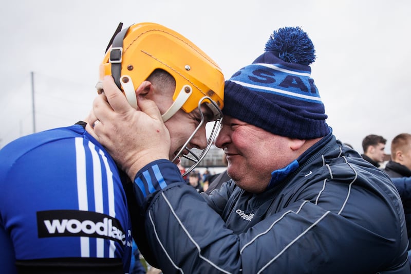 Sarsfields' Luke Elliott celebrates with Tom Holohan after the game. Photograph: Ben Brady/Inpho