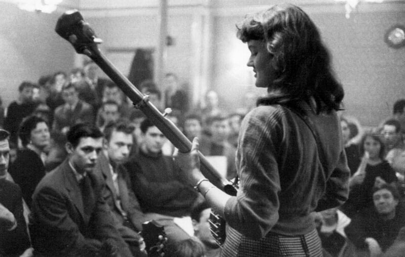 Peggy Seeger performs at a folk club session in Enterprise Public House, Long Acre, London, late 1950s-early 1960s. Photograph: EFD SS/Heritage Images/Getty Images