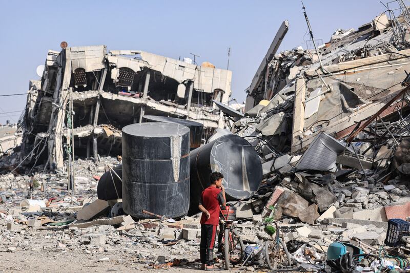 Palestinians inspect the damage to their homes and search for belongings amid the rubble of destroyed buildings in Al-Zahra on the southern outskirts of Gaza City, on November 26th. Photograph: Mahmud Hams/AFP via Getty Images