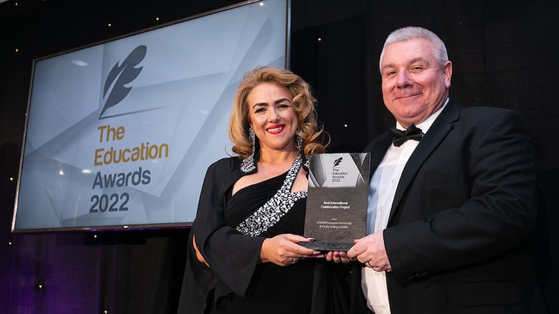 Denise McMorrow, Awards Judge, presents the Best International Collaboration Project Award to Gerard O'Donovan, Awards Judge, on behalf of CHARM European University & Trinity College Dublin.