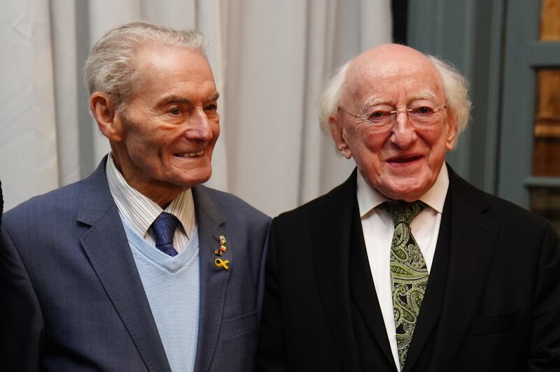 Michael D Higgins, right, with Holocaust survivor Tomi Reichental as they arrive at a Holocaust Memorial Day event at the Mansion House, Dublin. Photograph: Brian Lawless/PA