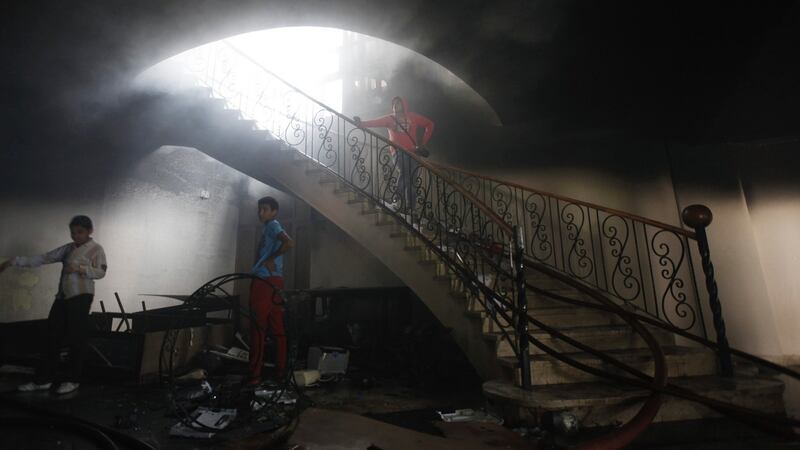 Fire damage is inspected at Egyptian Soccer Federation premises after Al-Ahly fans, also known as "Ultras", set it ablaze following the confirmation of death sentences earlier for 21 football fans for their role in a stadium riot which killed dozens of people in Port Said last year. Photograph: Amr Abdallah