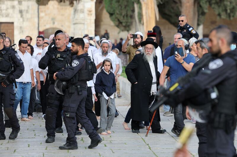 Jewish visitors, protected by Israeli security forces, at the Al-Aqsa mosque compound, also known as the Temple Mount complex to Jews, in Jerusalem on Sunday. Photograph: Ahmad Gharabli/AFP/Getty 