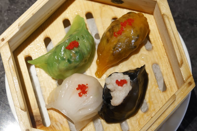 Dim sum platter – crystal prawn dumpling; spinach juice, prawn and chives dumpling; golden mixed mushroom dumpling; and squid-ink crab meat dumpling. Photograph: Nick Bradshaw