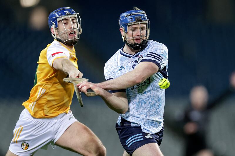 Dublin's Conor Burke and Antrim's Scott Walsh of Antrim during their Division 1B game at Cusack Park, Mullingar. Photograph: Laszlo Geczo/Inpho