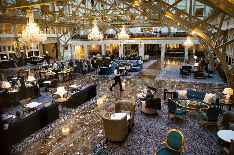 The lobby of the Trump International Hotel in Washington, a hotel which is loaded with debt and losing money. Photograph: Al Drago/The New York Times.